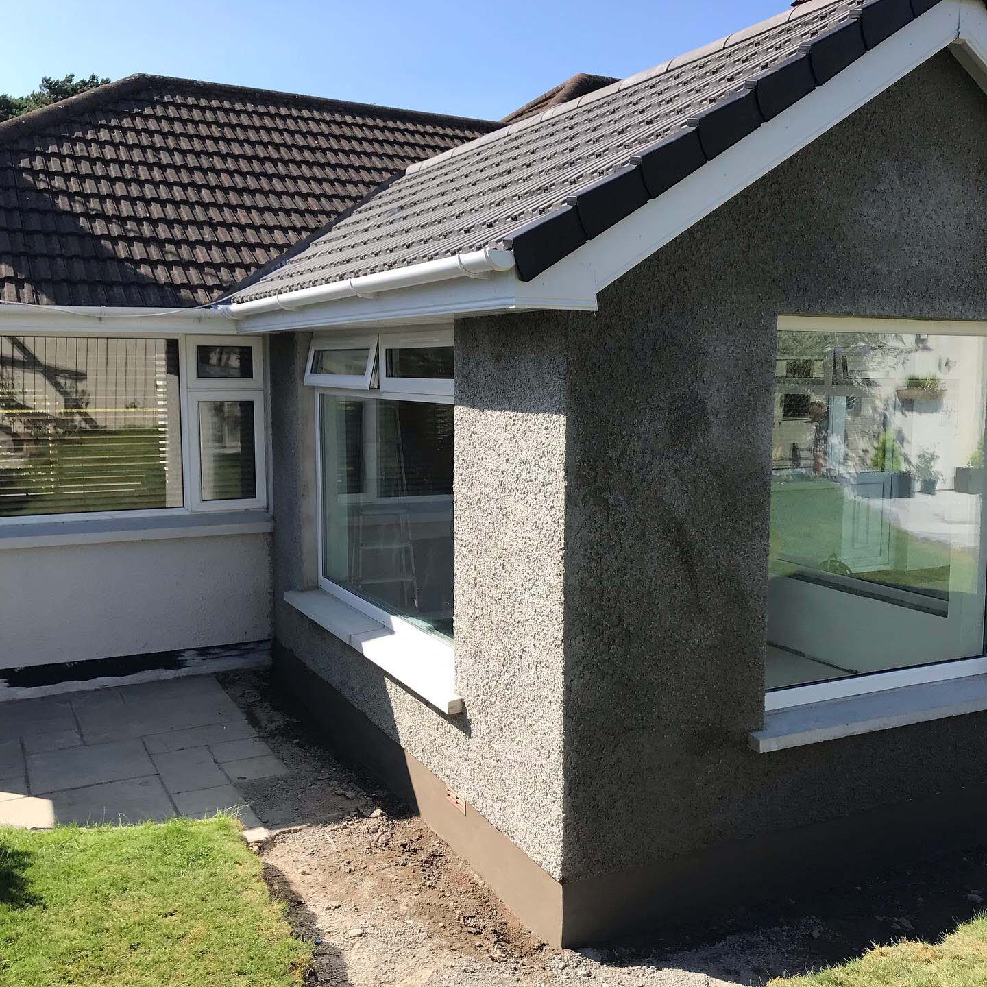 Stone finish extension on the side of house